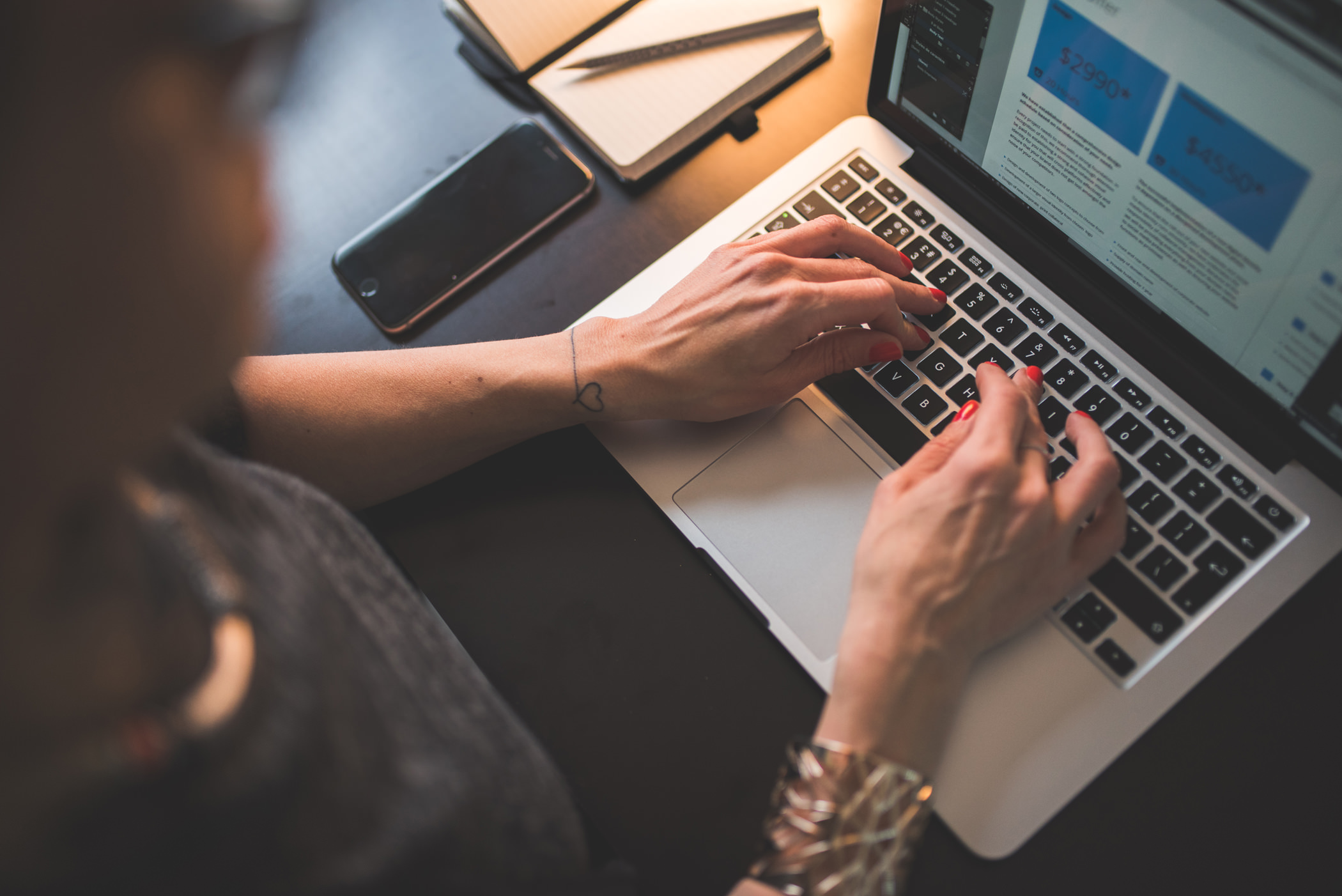 Web designer working on a website layout at a laptop